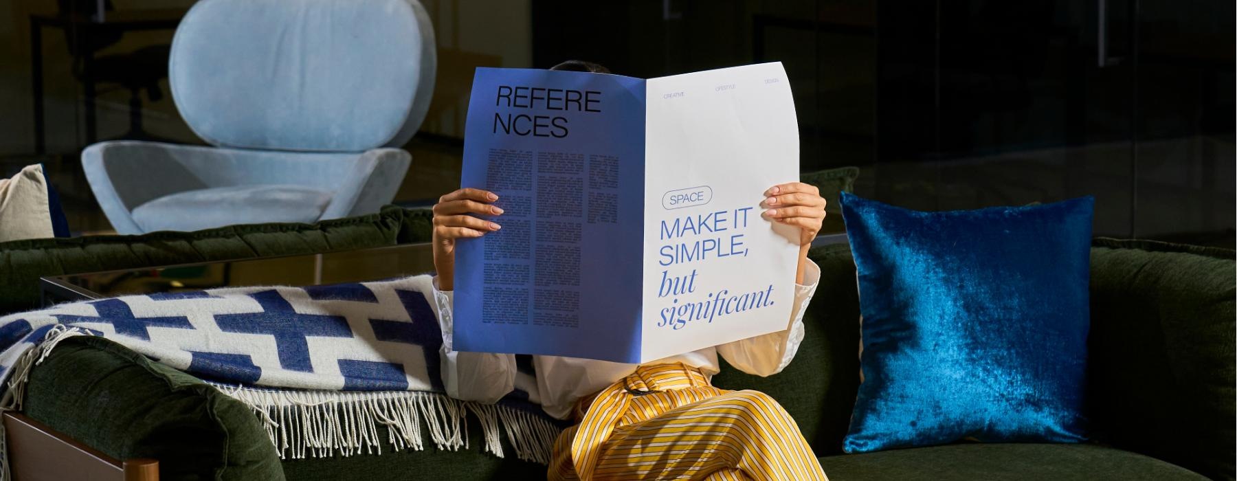 a person reading a newspaper