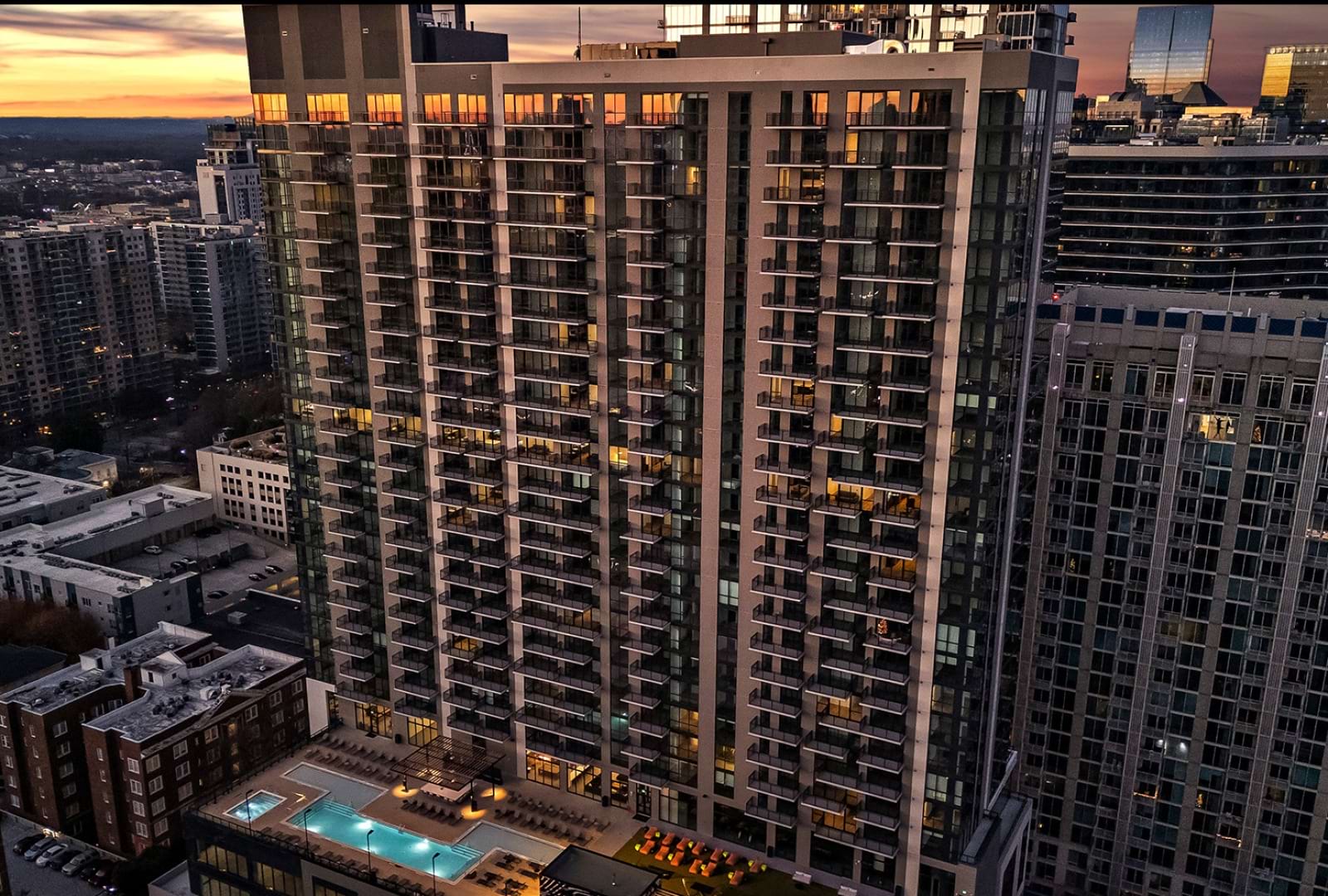Aerial image of a high-rise apartment in the middle of downtown Atlanta.